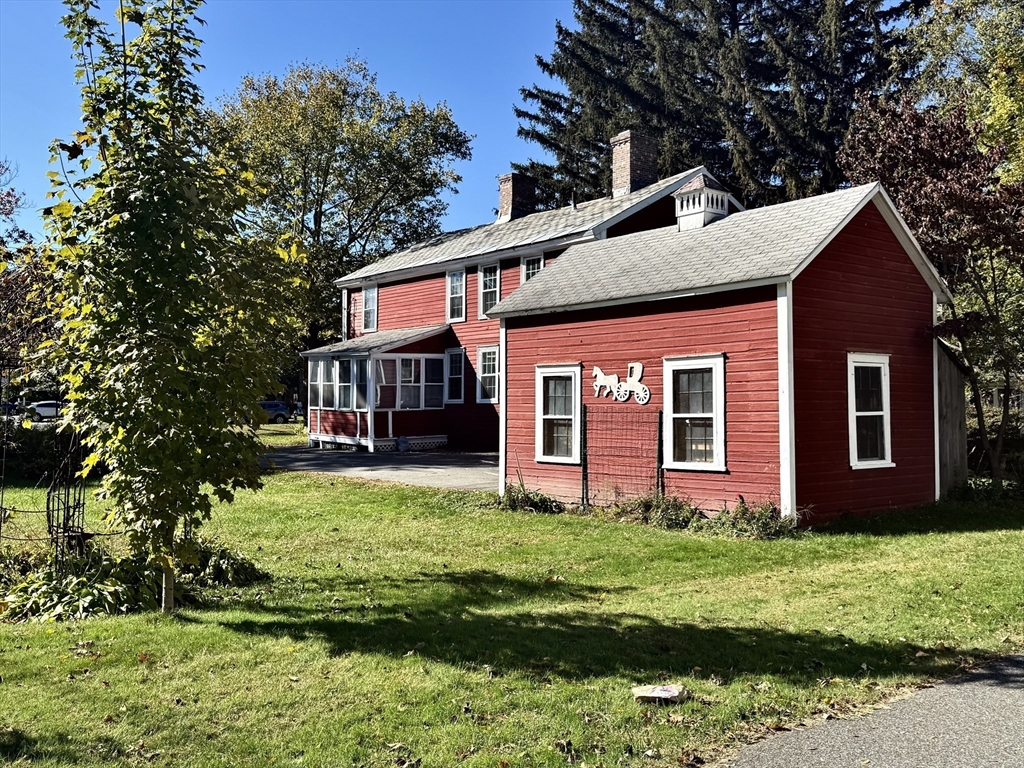 334 Elm Street West Springfield, MA 01089 - Photo 5 of 42 a front view of a house with a yard