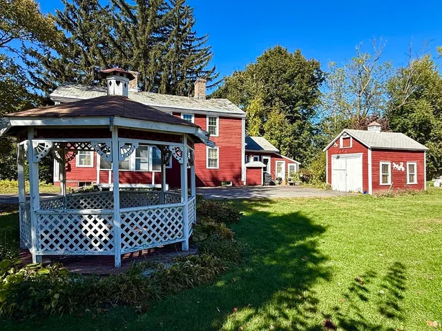 a view of a chairs and table in the garden