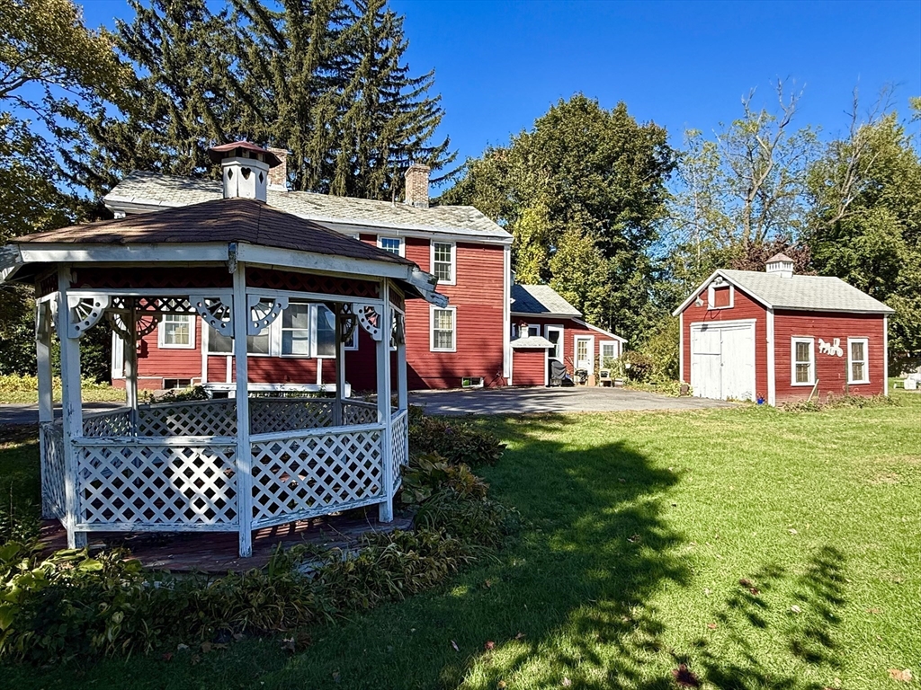 334 Elm Street West Springfield, MA 01089 - Photo 6 of 42 a view of a chairs and table in the garden