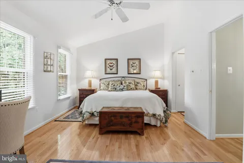 a bedroom with a bed and a dresser in it