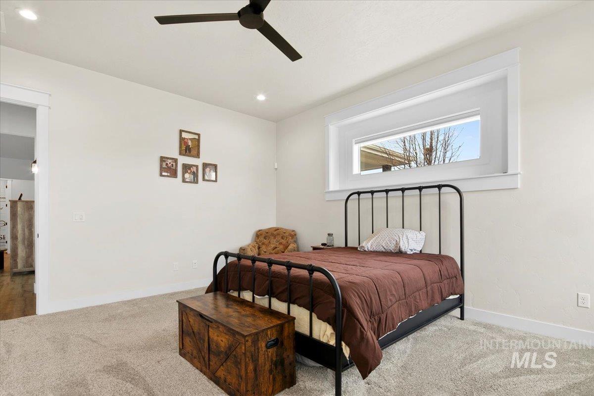 6721 El Paso Road Caldwell, ID 83607 - Photo 22 of 50 Bedroom featuring carpet floors, a ceiling fan, and recessed lighting