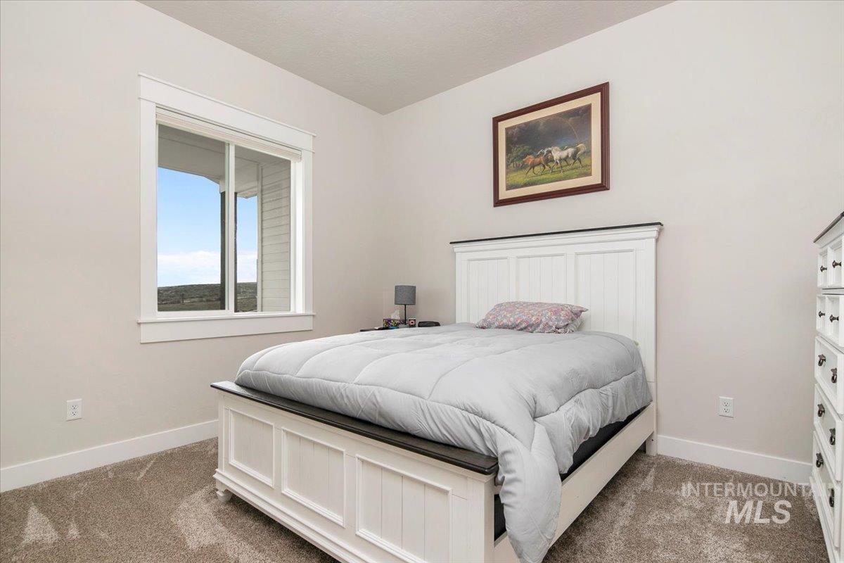 6721 El Paso Road Caldwell, ID 83607 - Photo 29 of 50 Bedroom with baseboards and carpet floors