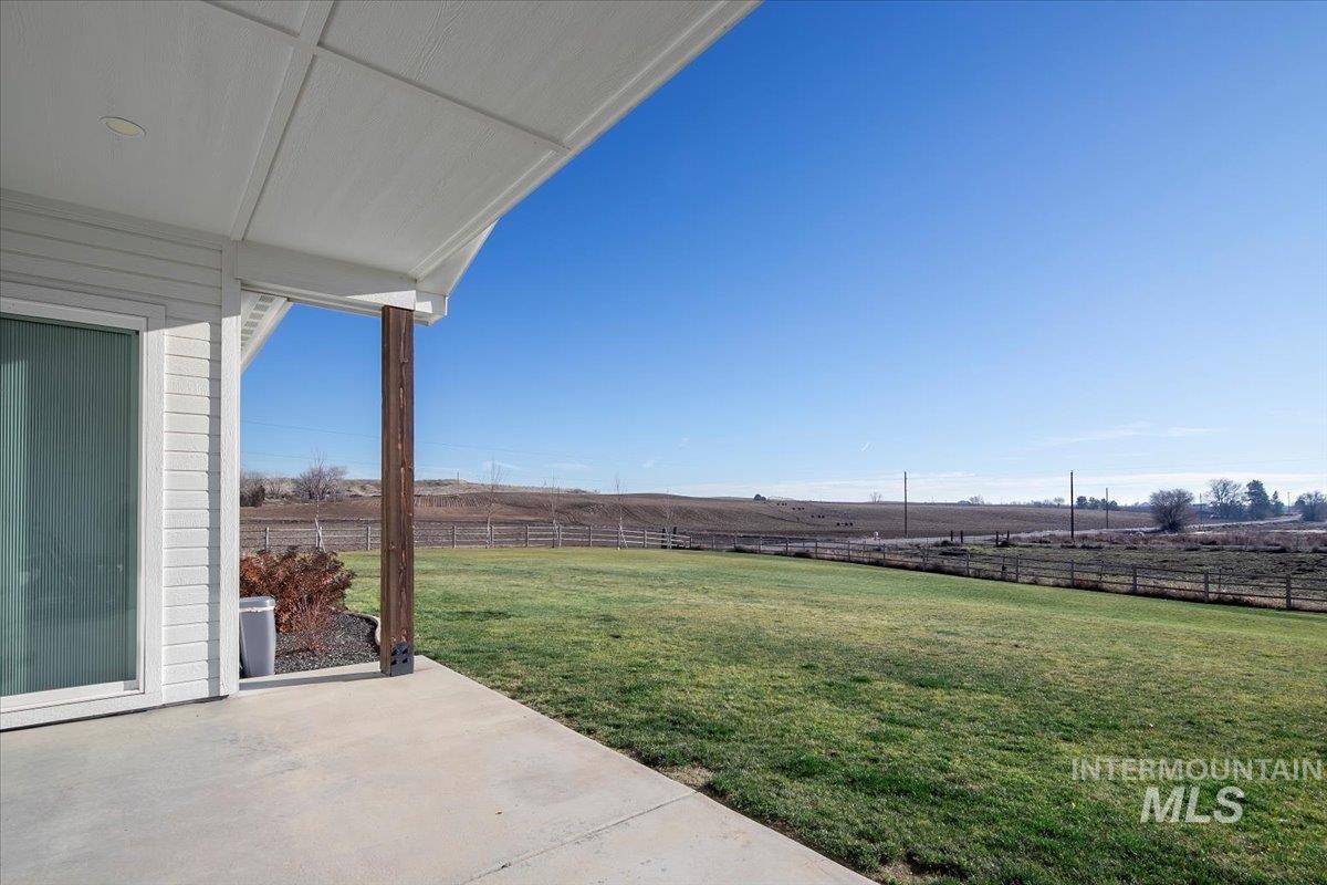 6721 El Paso Road Caldwell, ID 83607 - Photo 37 of 50 Fenced backyard featuring a view of countryside and a patio area