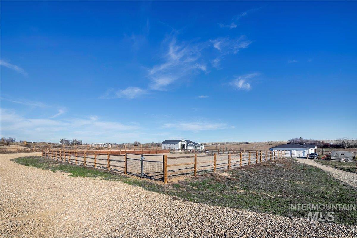 6721 El Paso Road Caldwell, ID 83607 - Photo 40 of 50 View of yard featuring an enclosed riding area and a view of countryside