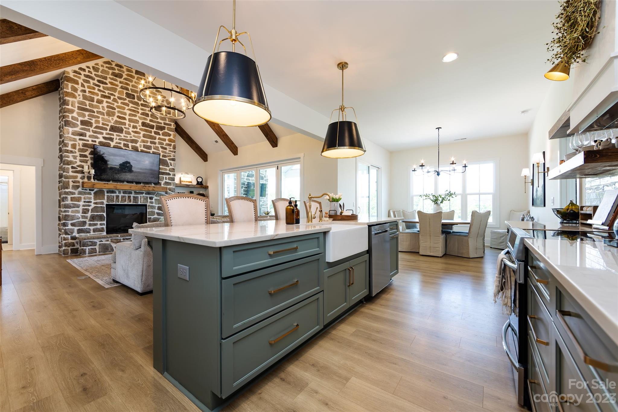 4316 Nesbit Road Monroe, NC 28112 - Photo 11 of 47 a kitchen with stainless steel appliances kitchen island granite countertop a sink a counter space and cabinets