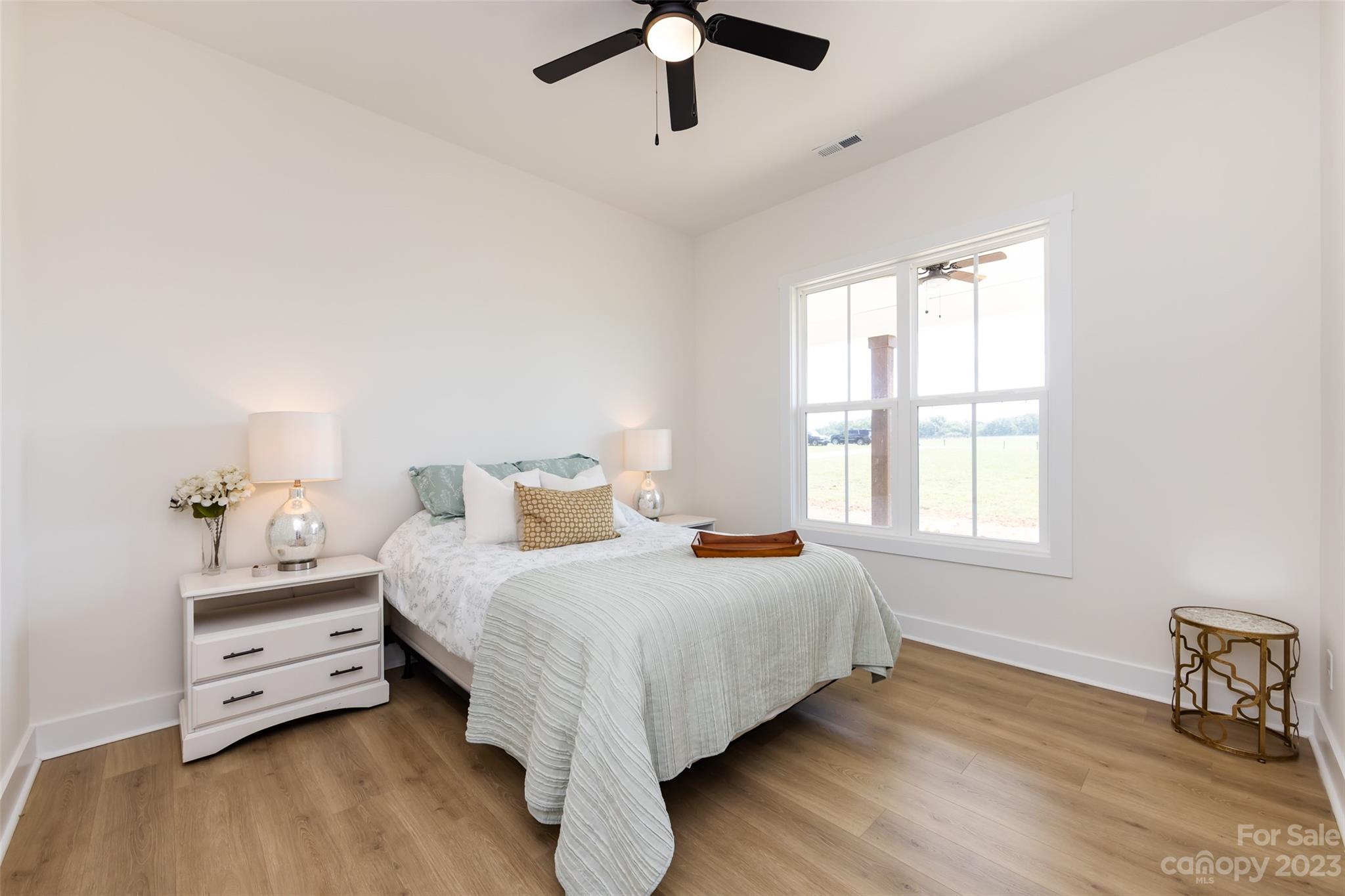 4316 Nesbit Road Monroe, NC 28112 - Photo 21 of 47 a bedroom with a bed and wooden floor