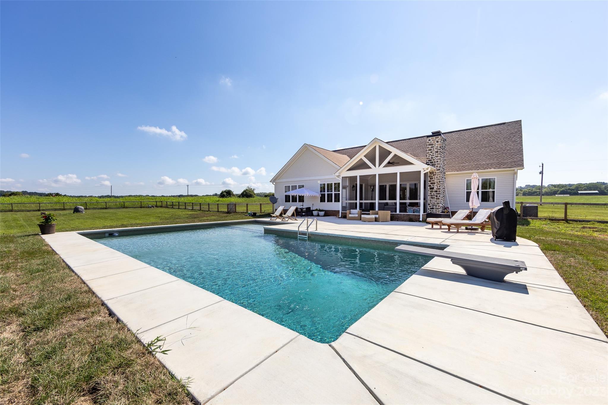 4316 Nesbit Road Monroe, NC 28112 - Photo 38 of 47 a view of swimming pool with outdoor seating and house in the background