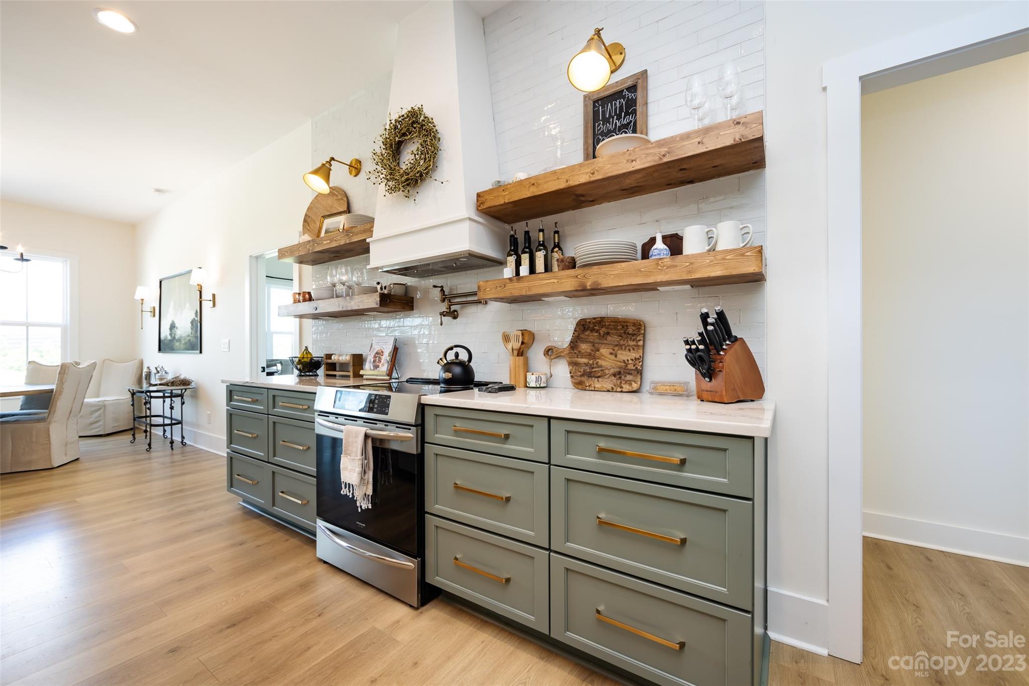 4316 Nesbit Road Monroe, NC 28112 - Photo 9 of 47 a kitchen with stainless steel appliances granite countertop a stove and cabinets