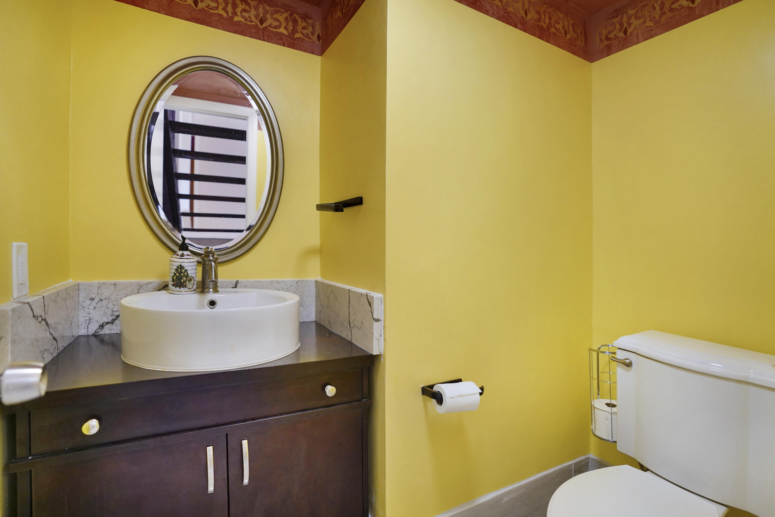 2674 Northwest 41st Street Boca Raton, FL 33434 - Photo 20 of 48 a bathroom with a sink and a mirror