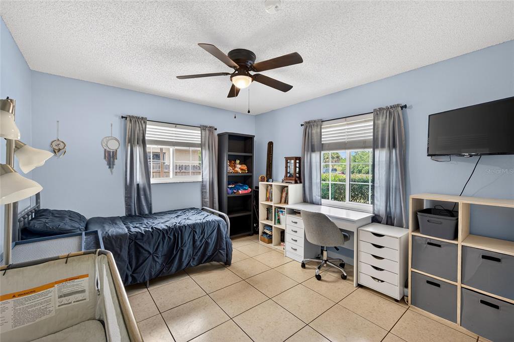 532 Center Road Venice, FL 34285 - Photo 21 of 68 a bedroom with furniture and a window