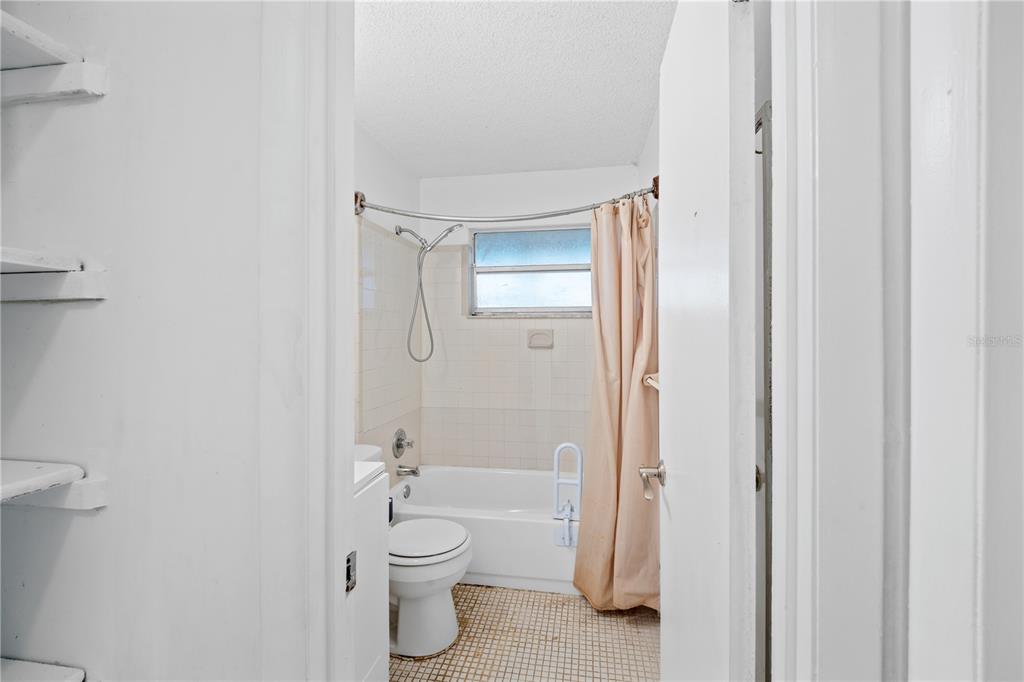 764 Lunar Lake Circle Cocoa, FL 32926 - Photo 14 of 17 a bathroom with a toilet and a shower