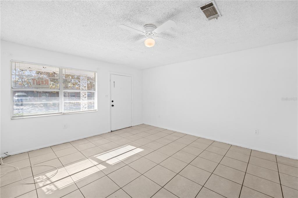 764 Lunar Lake Circle Cocoa, FL 32926 - Photo 16 of 17 an empty room with windows and fan