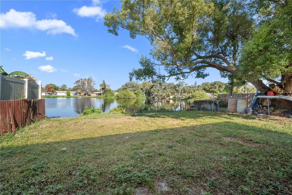 764 Lunar Lake Circle Cocoa, FL 32926 - Photo 4 of 17 a view of a yard with an tree