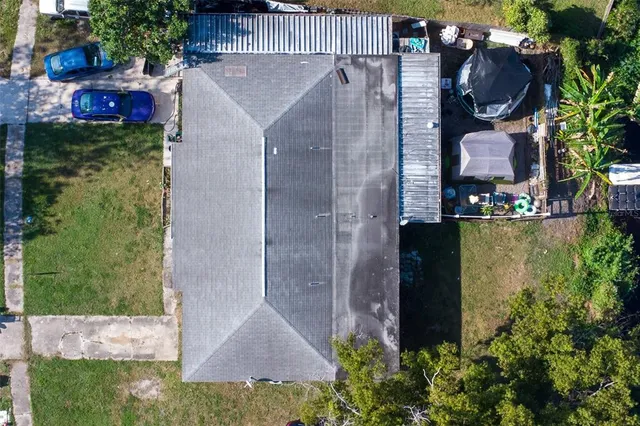 an aerial view of a house having yard