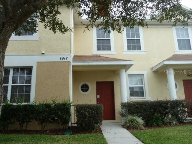 1917 Fiesta Ridge Court Tampa, FL 33604 - Photo 1 of 1 a front view of a house with garden