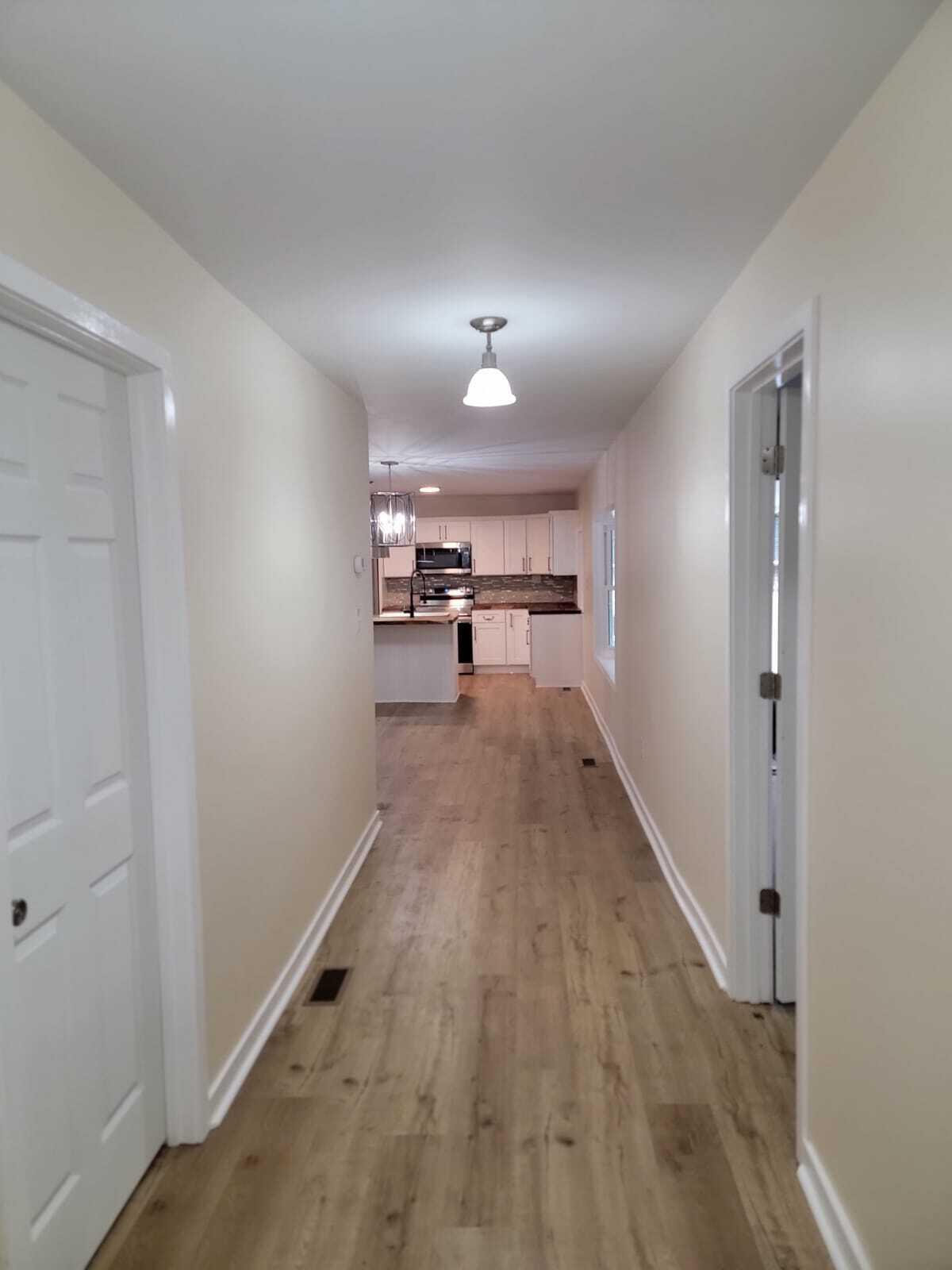 640 Cooks Knob Road Ferrum, VA 24088 - Photo 20 of 50 a view of a room with wooden floor a ceiling fan and windows