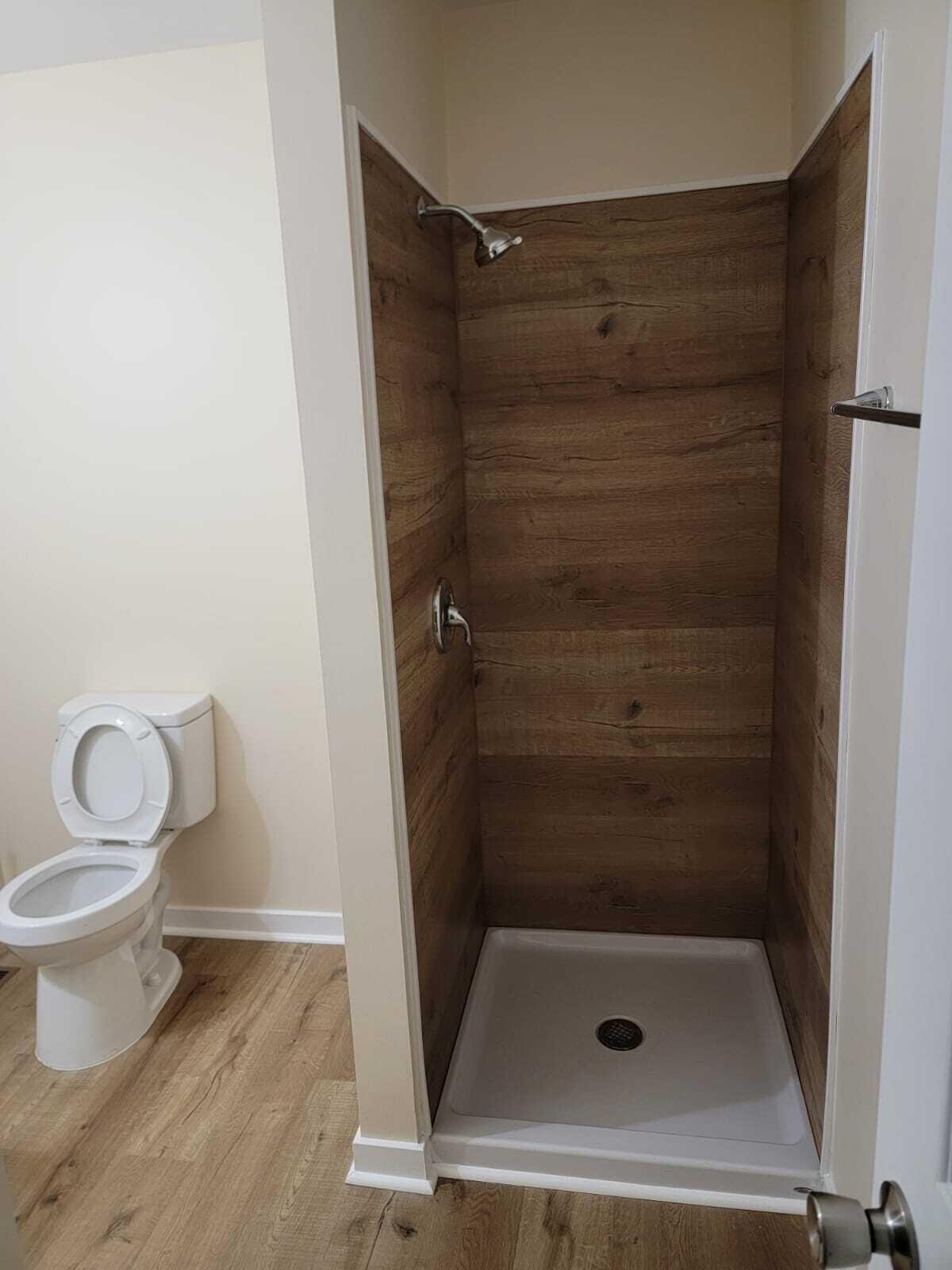640 Cooks Knob Road Ferrum, VA 24088 - Photo 24 of 50 a bathroom with a shower a toilet and a sink