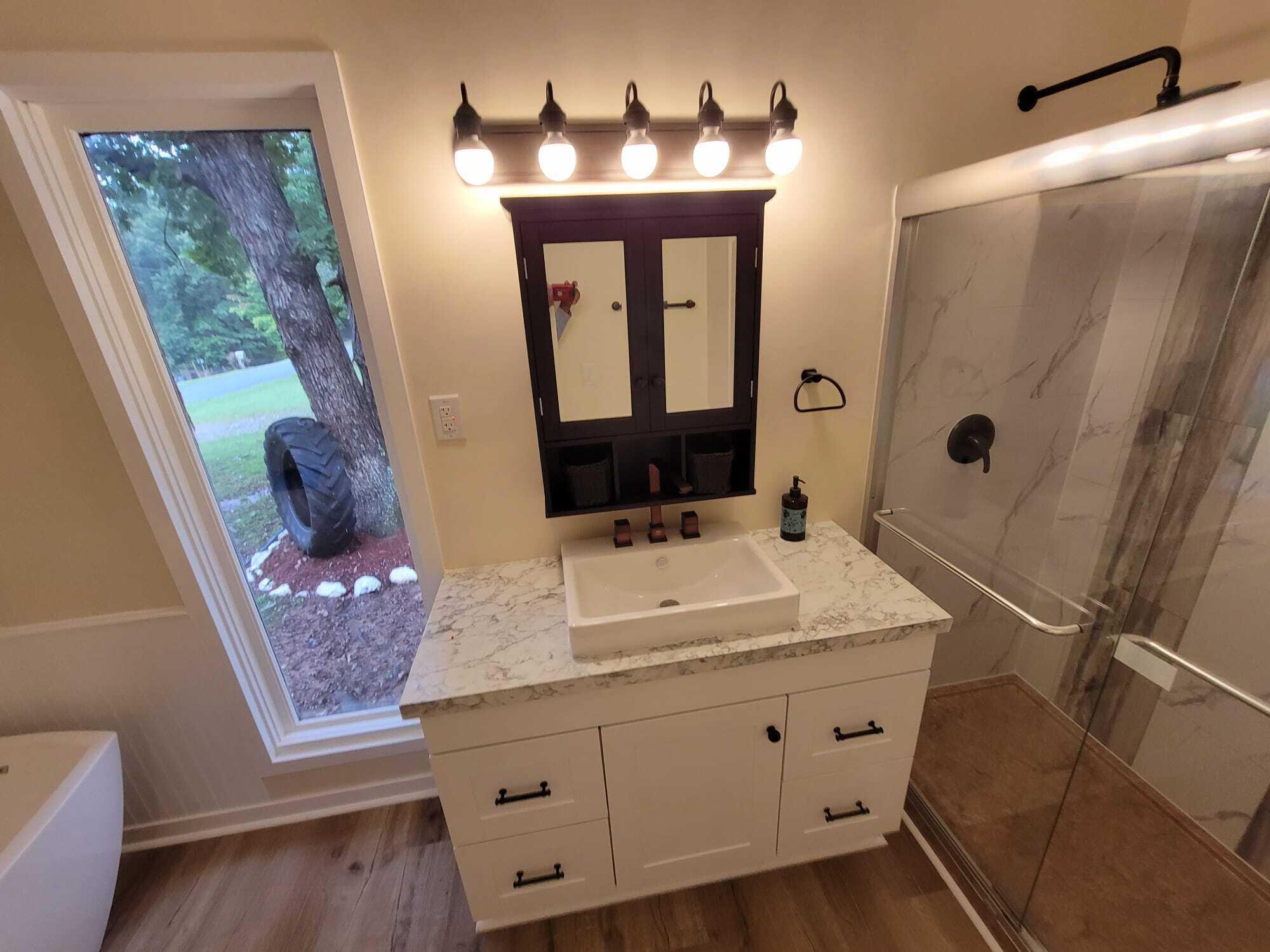640 Cooks Knob Road Ferrum, VA 24088 - Photo 28 of 50 a bathroom with a sink vanity and mirror