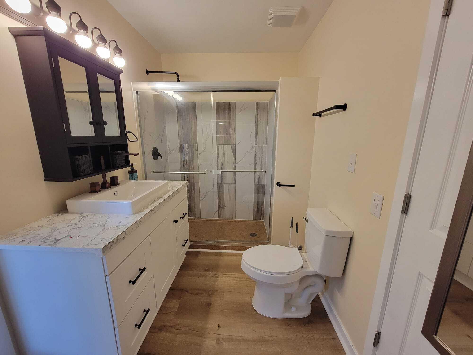 640 Cooks Knob Road Ferrum, VA 24088 - Photo 29 of 50 a bathroom with a granite countertop sink toilet and shower