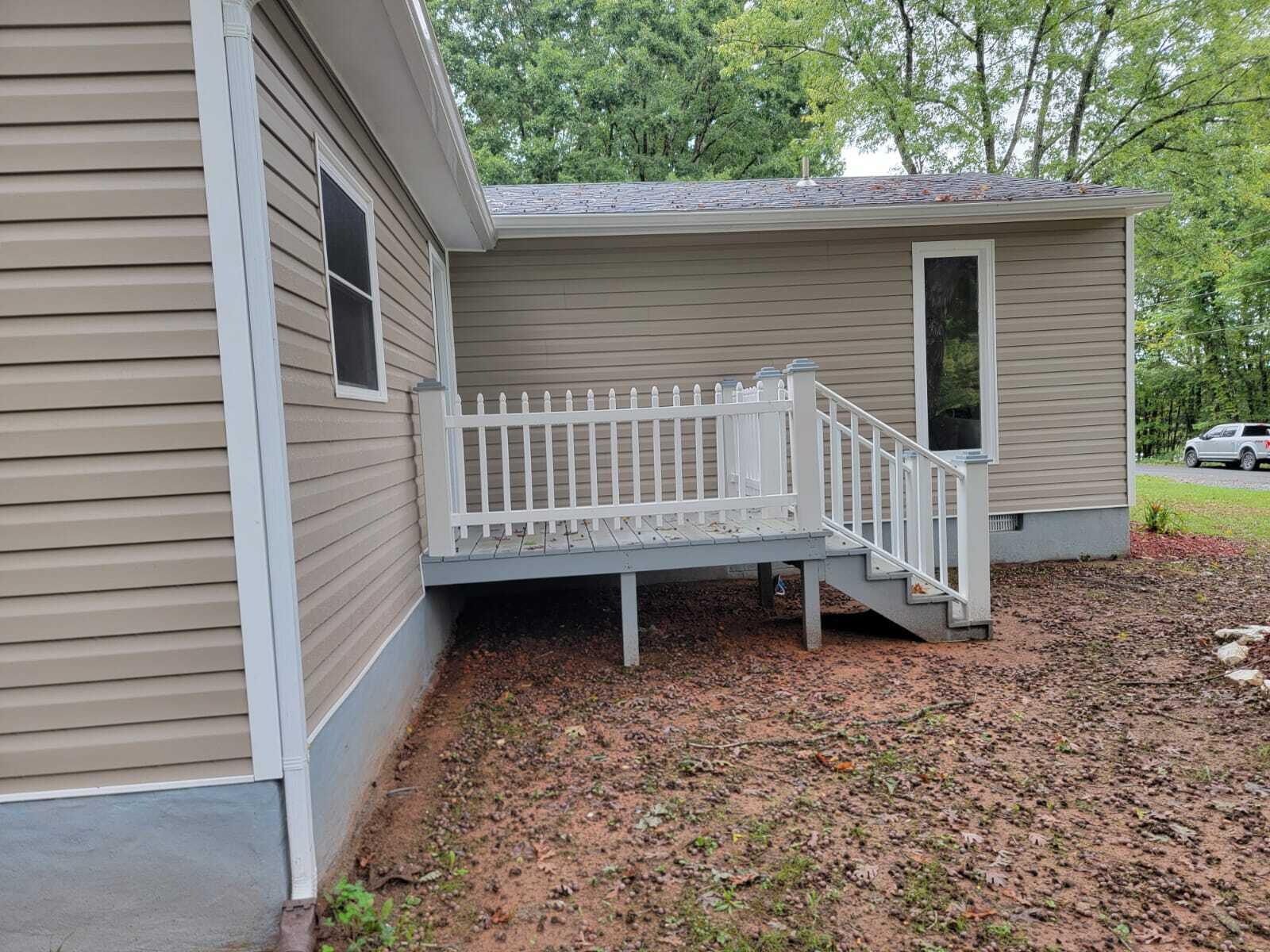 640 Cooks Knob Road Ferrum, VA 24088 - Photo 40 of 50 a white house that has a small garden