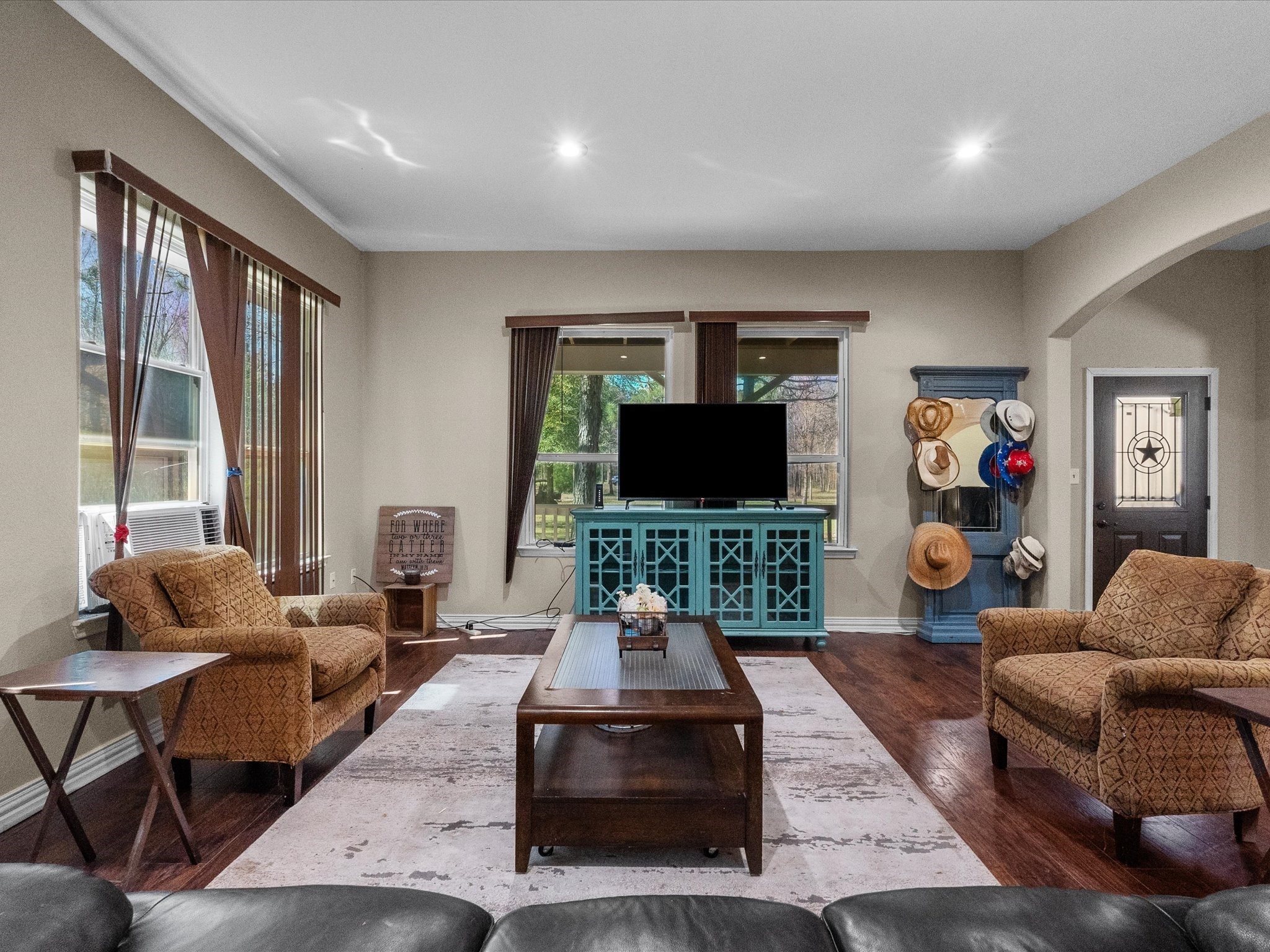 1151 County Line Road Shepherd, TX 77371 - Photo 11 of 40 a living room with furniture and a flat screen tv