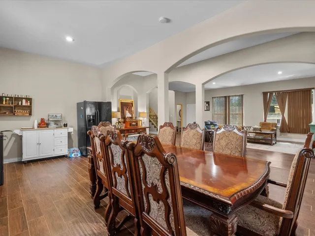 a view of a dining room with furniture and wooden floor