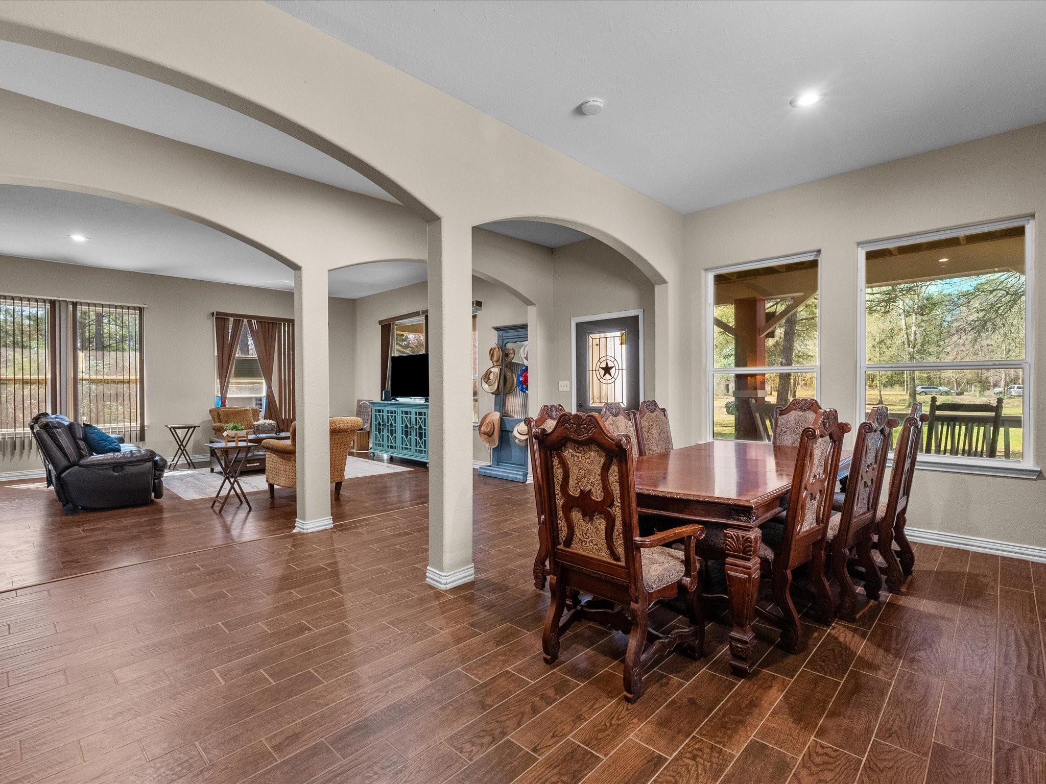 1151 County Line Road Shepherd, TX 77371 - Photo 15 of 40 a view of a dining room with furniture and wooden floor