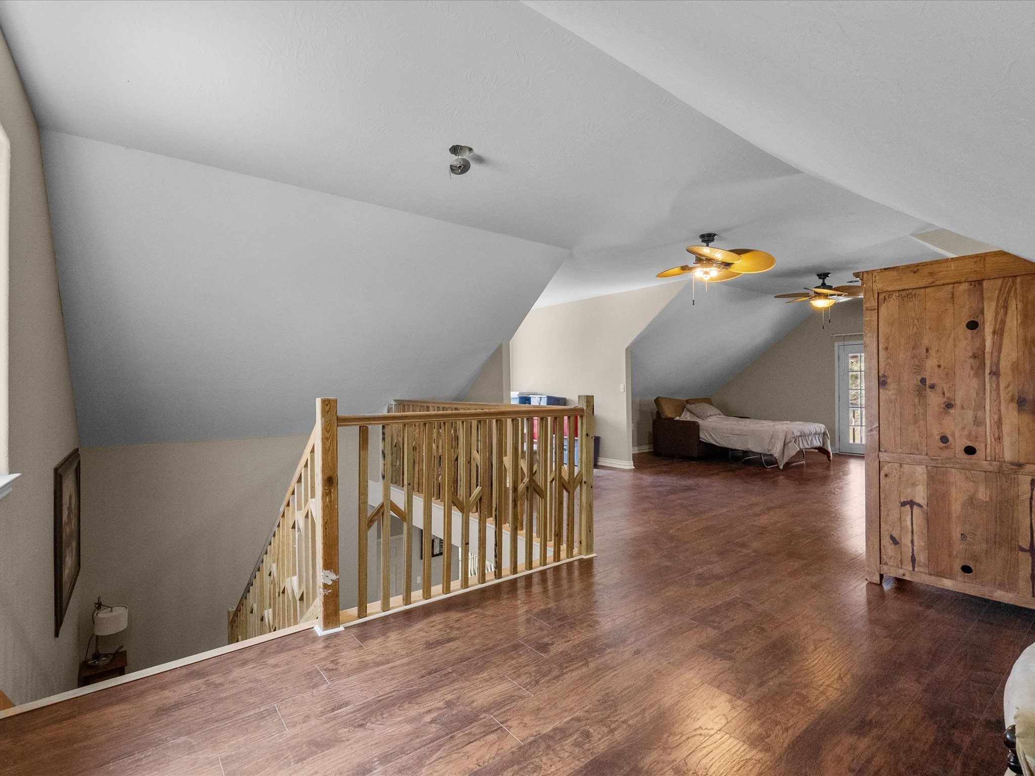1151 County Line Road Shepherd, TX 77371 - Photo 21 of 40 a view of a hallway with wooden floor and stairs