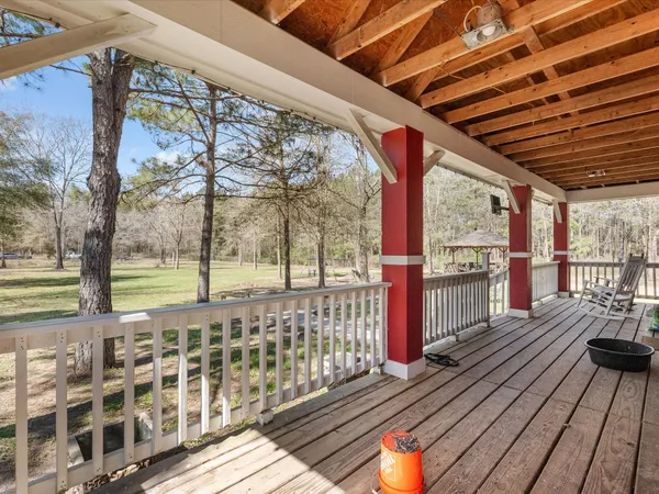 a view of a balcony with wooden floor