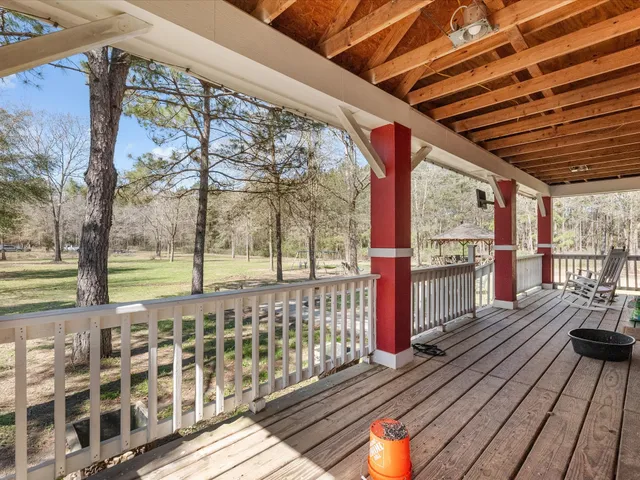 a view of a porch with wooden floor