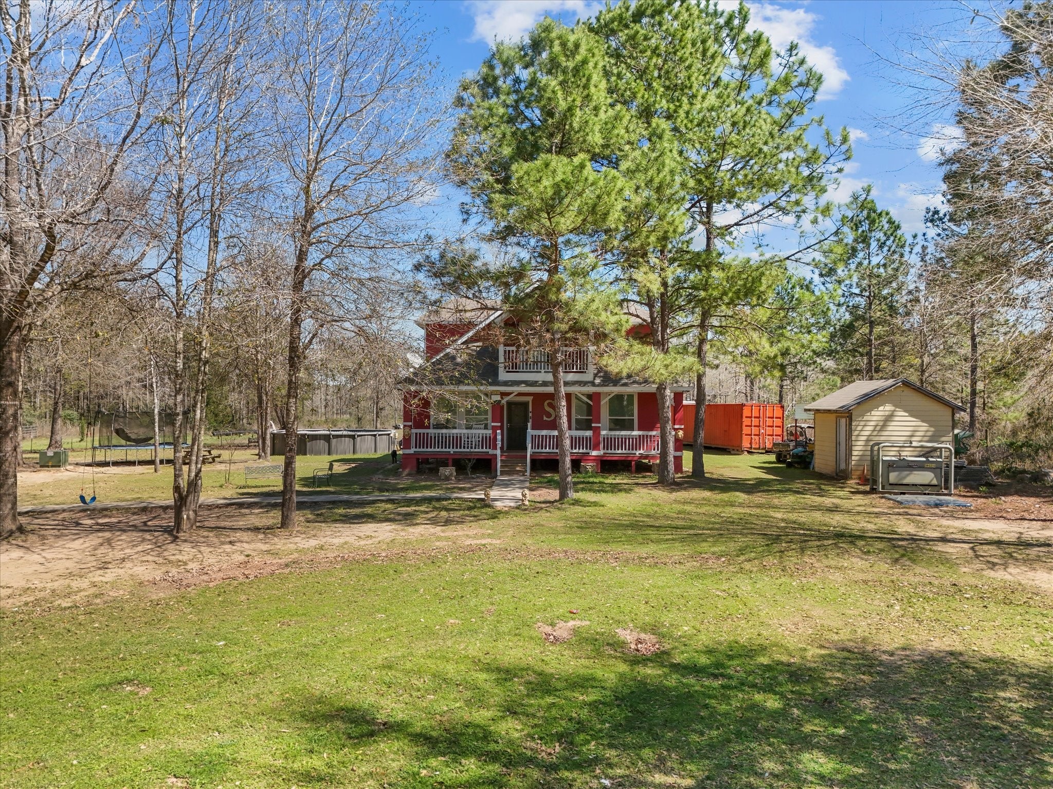 1151 County Line Road Shepherd, TX 77371 - Photo 35 of 40 a view of a house with a yard