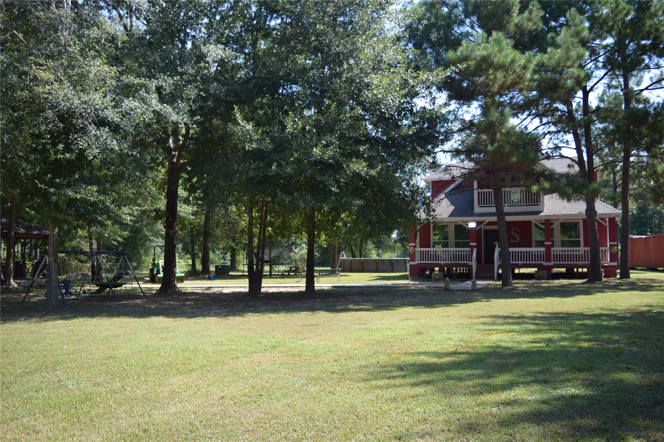 1151 County Line Road Shepherd, TX 77371 - Photo 5 of 40 a view of swimming pool with outdoor seating and a garden