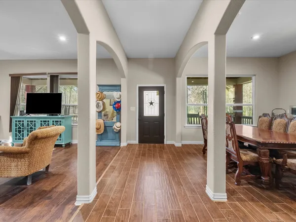 a view of a livingroom with furniture and wooden floor