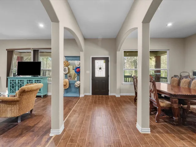 a view of a livingroom with furniture and wooden floor
