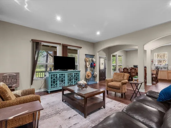 a living room with furniture and a flat screen tv