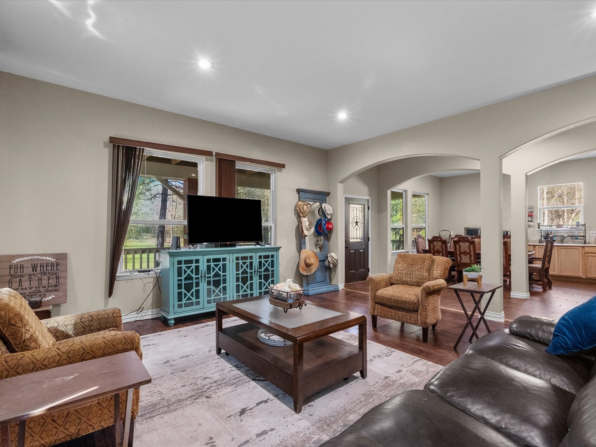 1151 County Line Road Shepherd, TX 77371 - Photo 10 of 40 a living room with furniture and a flat screen tv