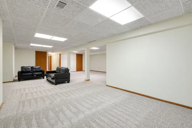 a big room with furniture and a flat screen tv