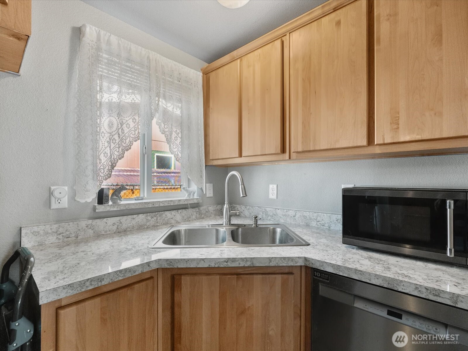 12721 West Macs Loop Road Granite Falls, WA 98252 - Photo 13 of 31 a kitchen with a sink and cabinets