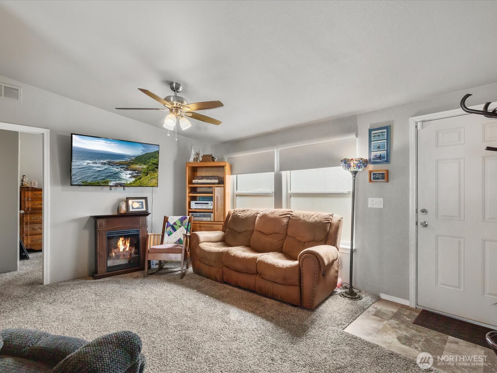 12721 West Macs Loop Road Granite Falls, WA 98252 - Photo 2 of 31 a living room with furniture and a fireplace