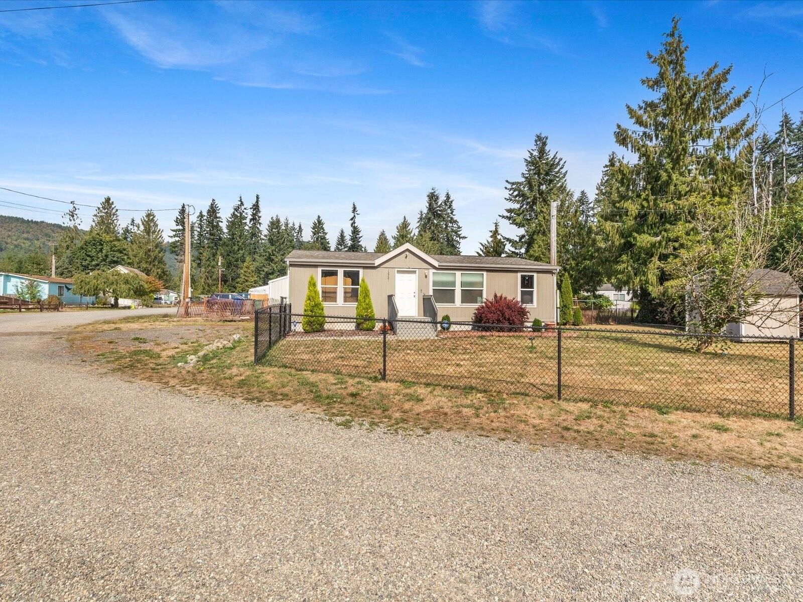 12721 West Macs Loop Road Granite Falls, WA 98252 - Photo 24 of 31 a view of a house with a yard