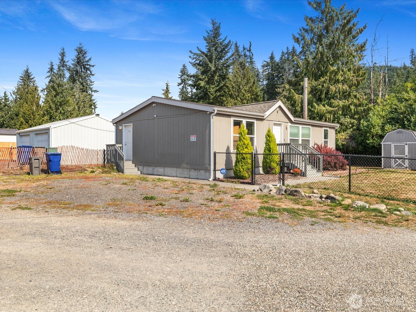 12721 West Macs Loop Road Granite Falls, WA 98252 - Photo 26 of 31 a view of a house with a yard