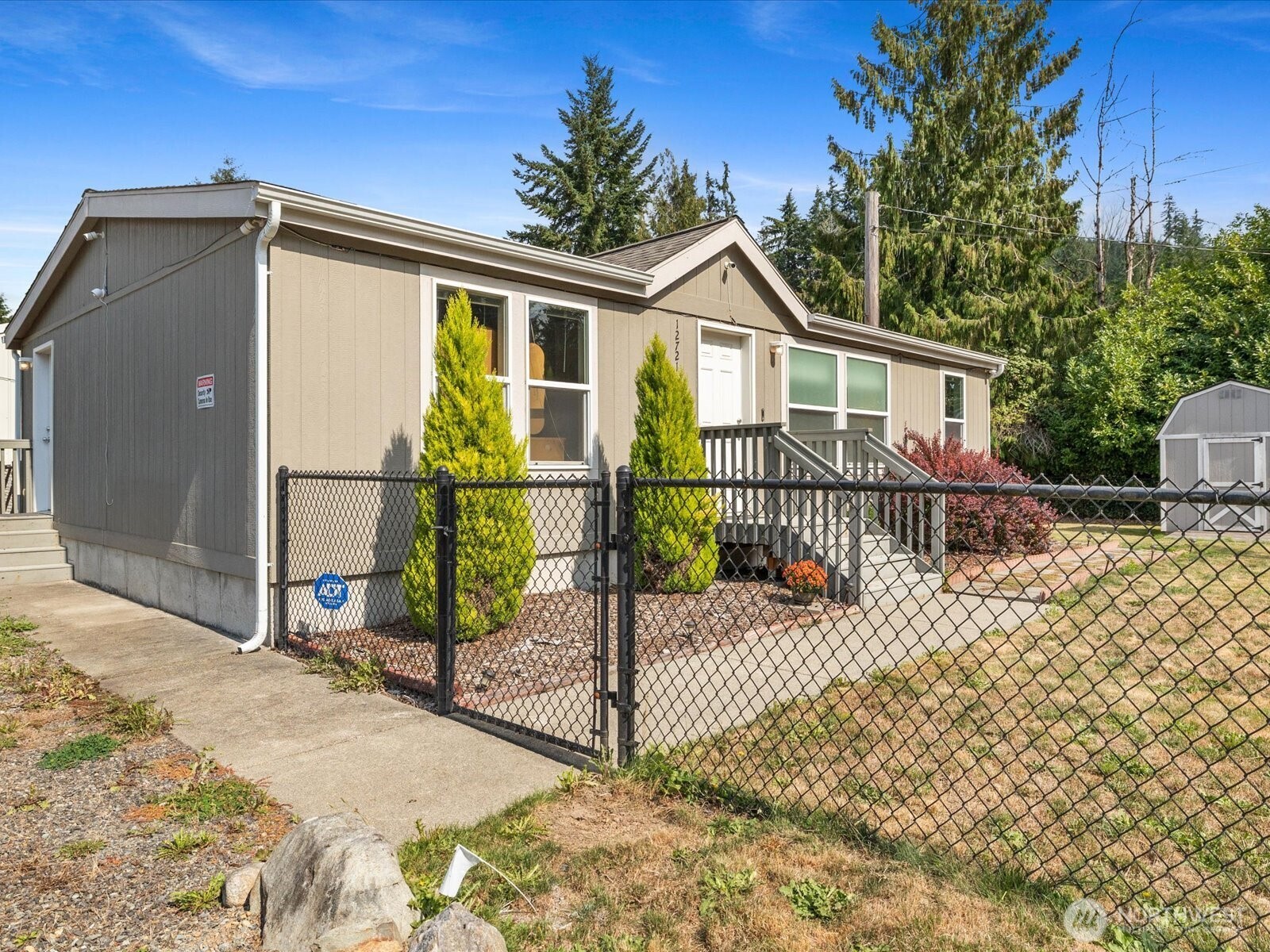 12721 West Macs Loop Road Granite Falls, WA 98252 - Photo 27 of 31 a view of a house with wooden fence