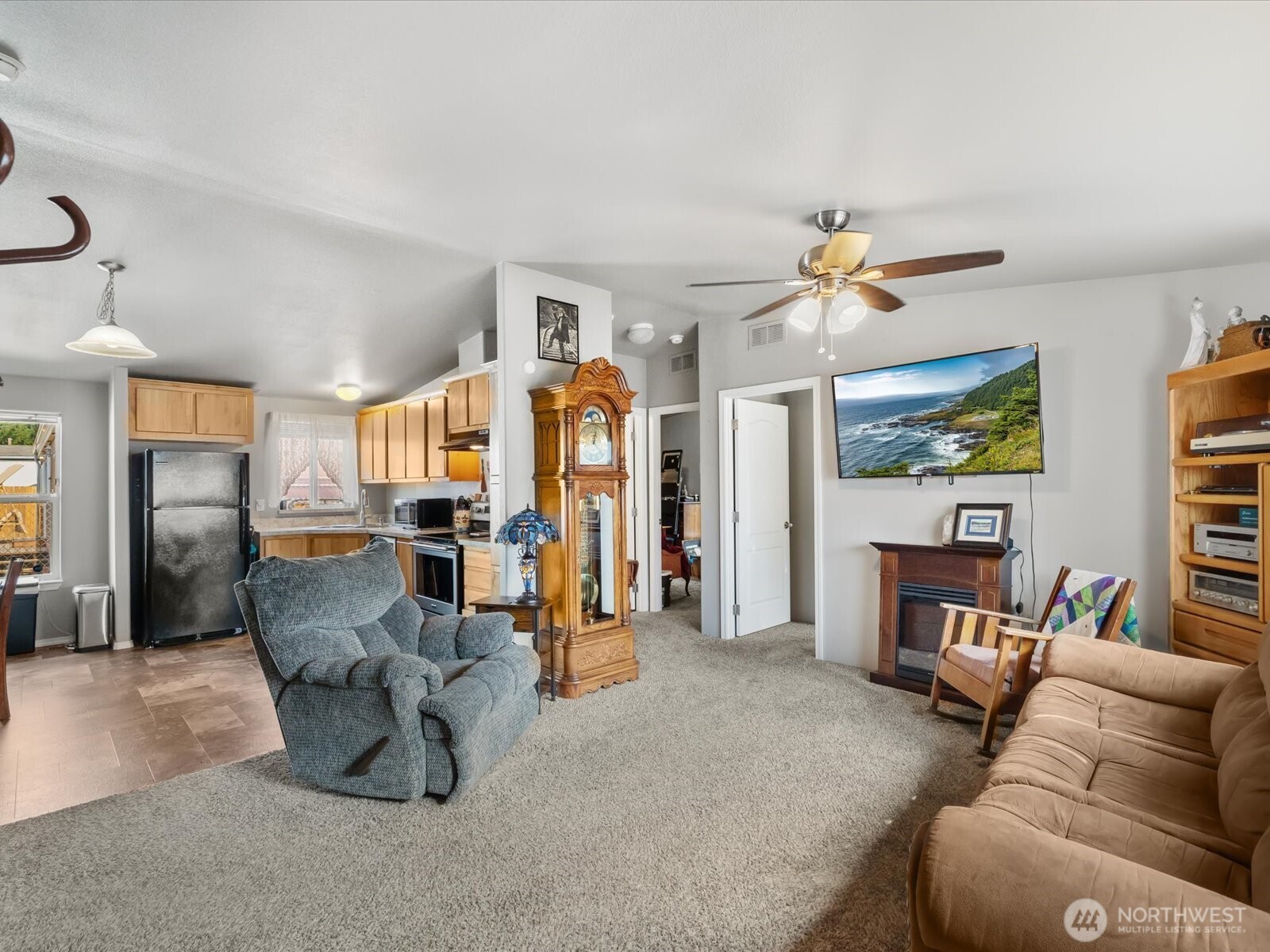 12721 West Macs Loop Road Granite Falls, WA 98252 - Photo 3 of 31 a living room with furniture and a flat screen tv