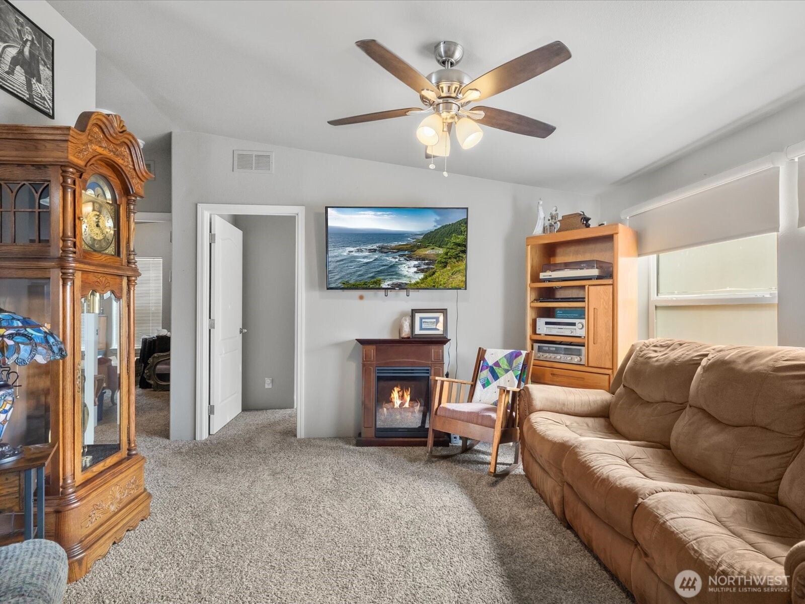 12721 West Macs Loop Road Granite Falls, WA 98252 - Photo 7 of 31 a living room with furniture and a fireplace