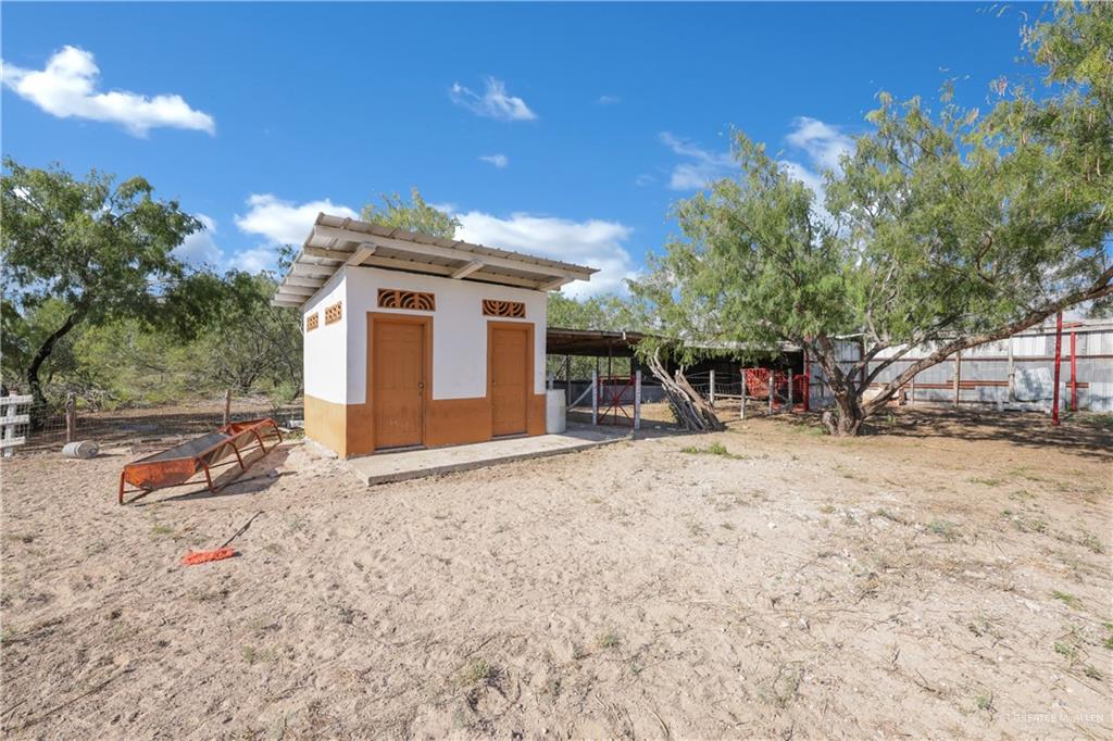0 North Moorefield Road Edinburg, TX 78541 - Photo 10 of 16 a view of a house with backyard and trees