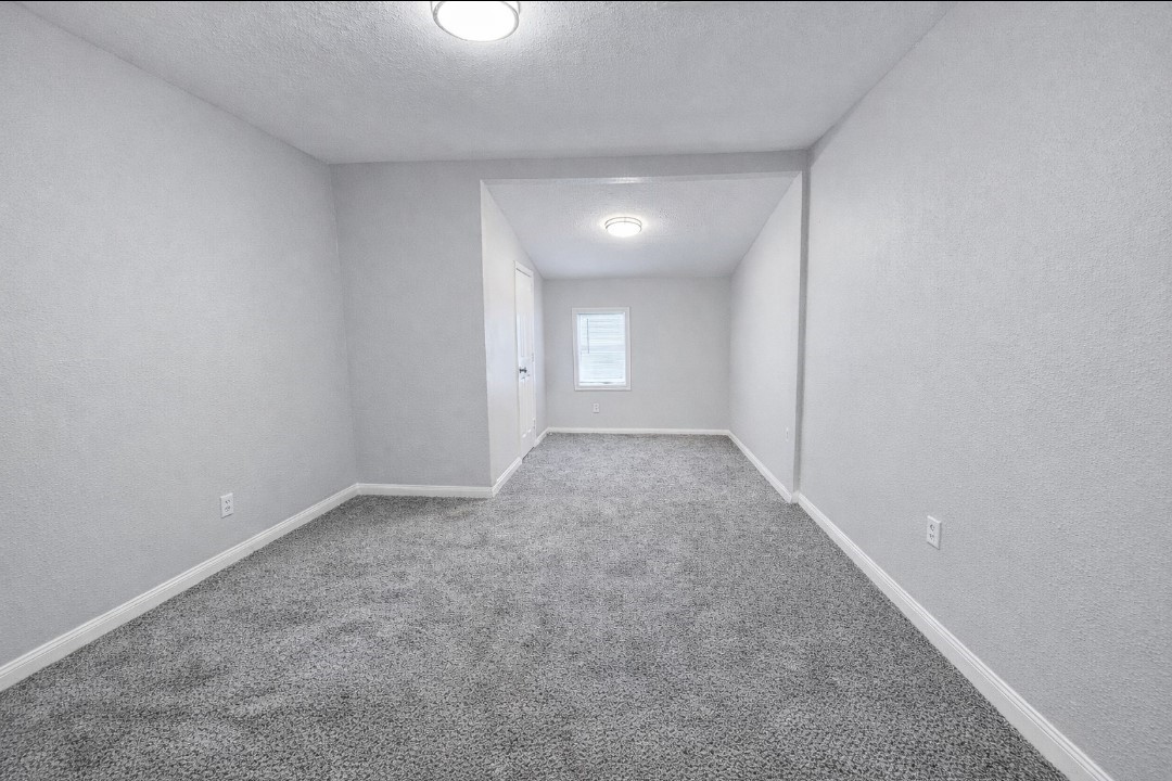 309 E Pine Daisetta, TX 77533 - Photo 11 of 23 a view of an empty room and window