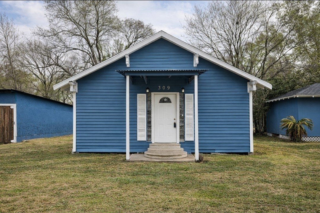 309 E Pine Daisetta, TX 77533 - Photo 22 of 23 a view of a house with a yard