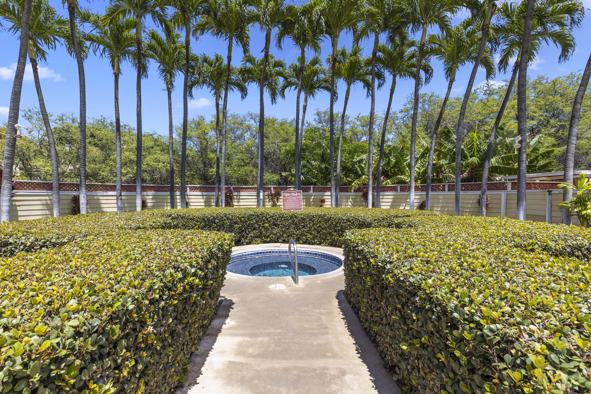 68-3831 Lua Kula Street, Unit G106 Waikoloa, HI 96738 - Photo 16 of 20 a view of a swimming pool with a garden