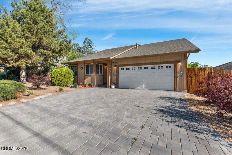 675 College Drive Reno, NV 89503 - Photo 2 of 30 a front view of a house with a yard and garage
