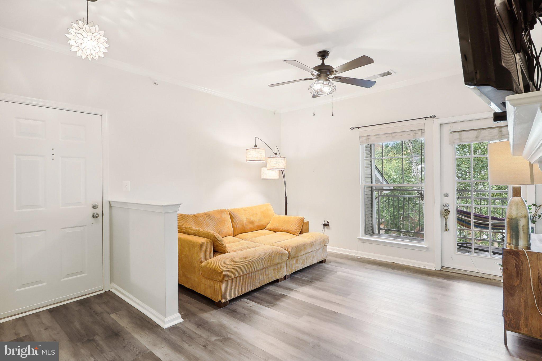 1516 North Point Drive, Unit 301 Reston, VA 20194 - Photo 13 of 31 a living room with furniture and a window